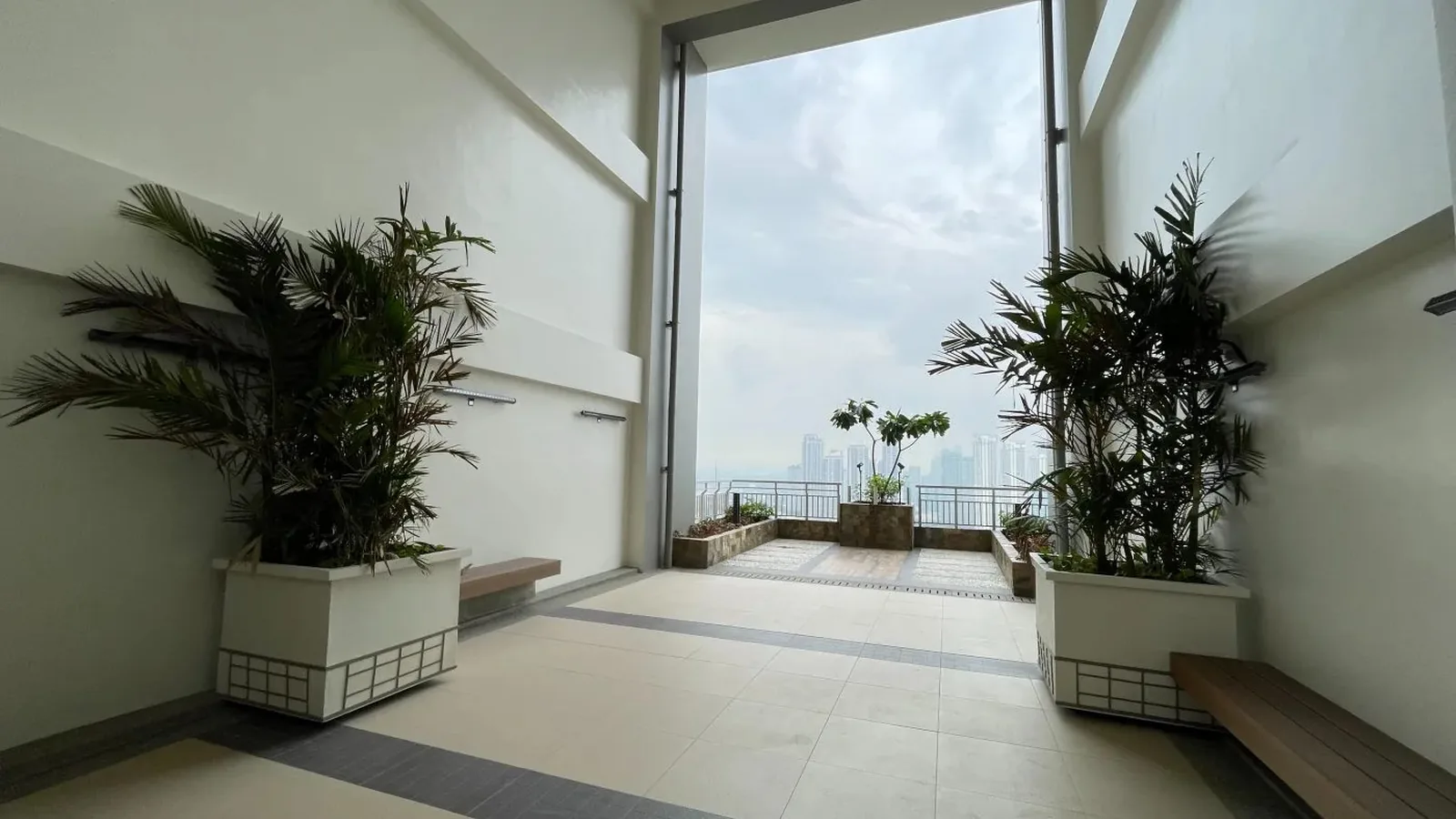 Sky Patio breezeway opening to the Metro Manila skyline at Kai Garden Residences, DMCI Homes condo in Mandaluyong, actual photo